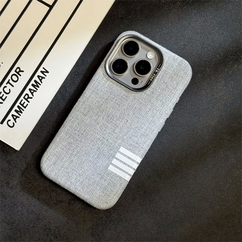 Luxury linen phone case for iPhone 13 and iPhone 14 Pro, featuring a minimalist design.