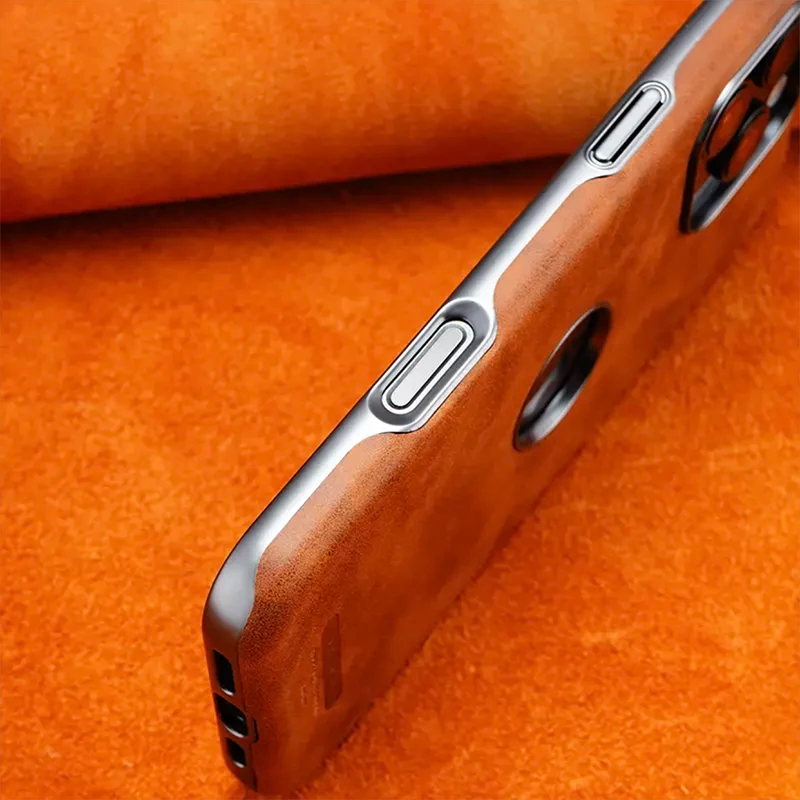 Close-up of a luxury leather iPhone case with buttons on a vibrant orange background.